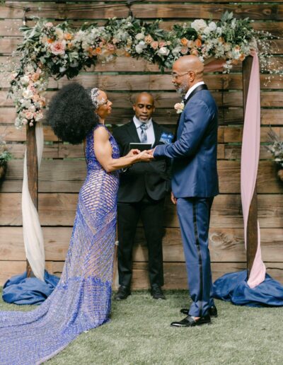 Dramatic rustic wedding arch with flowers